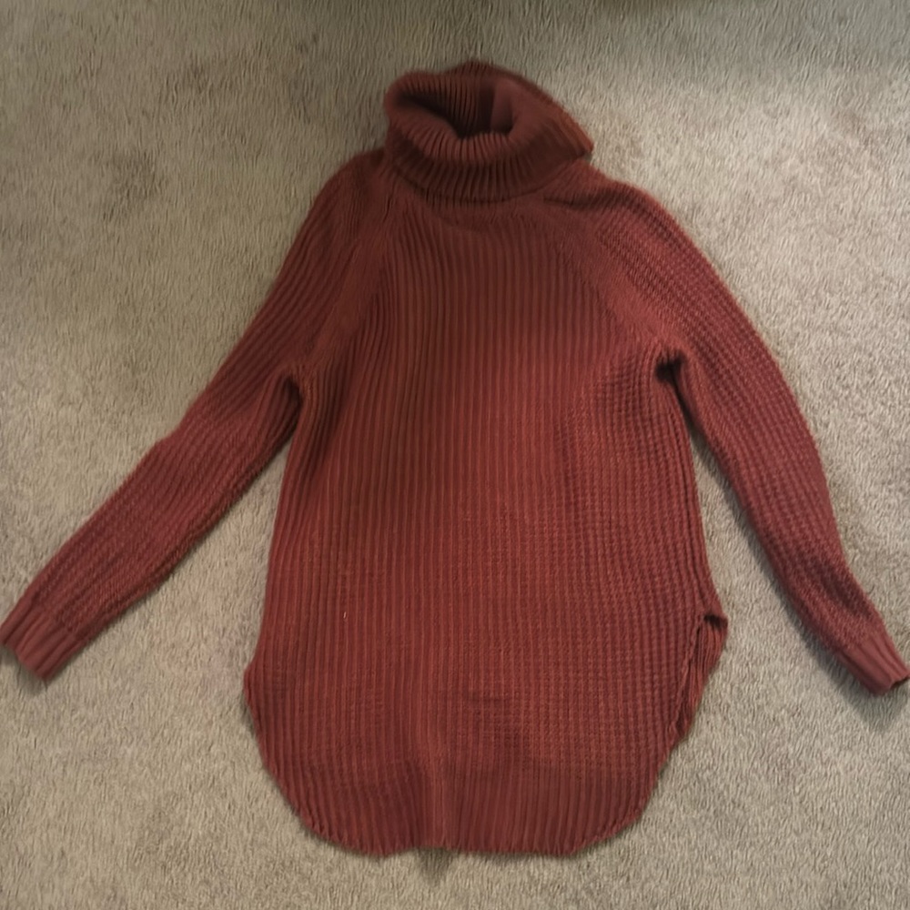 Deep burnt orange-ish tunic turtleneck sweater with slits on the side.